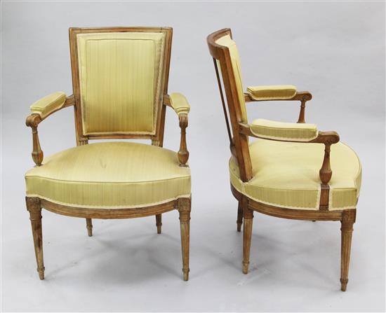 A set of four French Louis XVI style beech framed open armchairs,